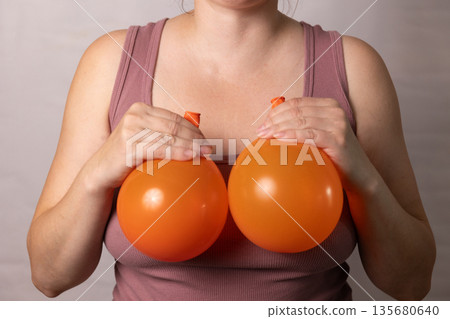 Discussing Changes in Breast Appearance After Pregnancy and Aging With Plastic Surgery Options 135680640