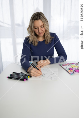 Woman at Desk Creates Neurographic Art With Markers for Mental Wellness Woman at Desk Creates Neurographic Art With Markers for Mental Wellness 135680659