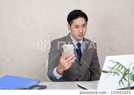 Businessman doing desk work 135681833