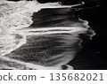 Black sand beach and wave pattern 135682021