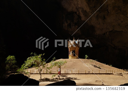 Phraya Nakhon Cave is located in Khao Sam Roi Yot National Park in Prachuap Khiri Khan Province in southern Thailand. Sunlight illuminates the temple.Phraya Nakhon Cave Temple. 135682319