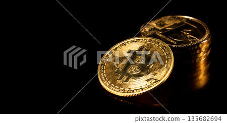 Bitcoin Cryptocurrency. Gold coins on black background. Bitcoin Cryptocurrency. Gold coins on black background. 135682694