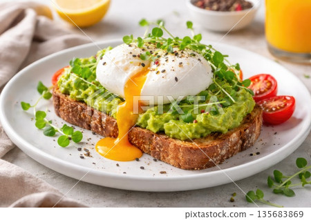 Healthy Avocado Toast with Poached Egg and Microgreens for Breakfast Healthy Avocado Toast with Poached Egg and Microgreens for Breakfast 135683869