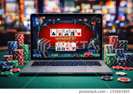 Online Poker Game on Laptop with Casino Chips and Cards in Gambling Concept 135683905