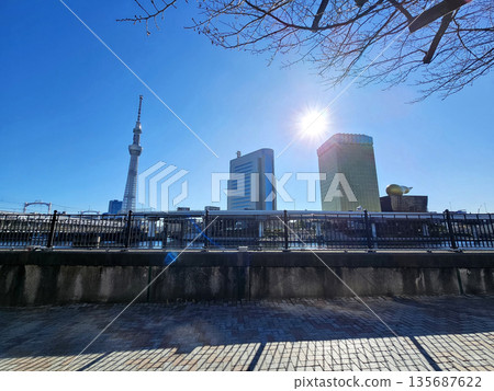 Tokyo Skytree and the skyline along the Sumida River with Sunrise and Bokeh. Tokyo Skytree and the skyline along the Sumida River with Sunrise and Bokeh. 135687622