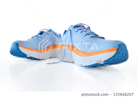 Blue orange running shoes for athletic activity 135688207