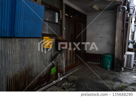 The entrance of a Showa-era mortar house, with a frosted glass sliding door 135688290