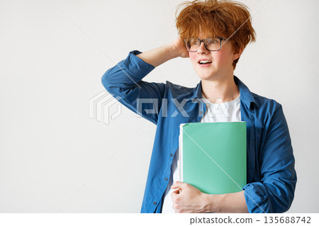 Student boy with messy red hair very surprised and excited Student boy with messy red hair very surprised and excited 135688742