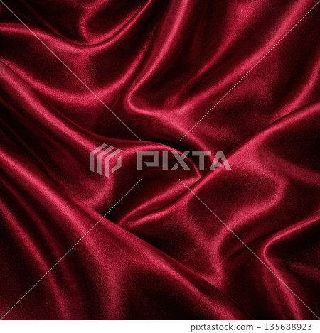 Luxury Burgundy Velvet Fabric with Soft Folds and Elegant Light Shadows Luxury Burgundy Velvet Fabric with Soft Folds and Elegant Light Shadows 135688923