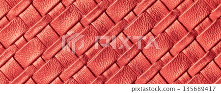 Texture dark coral leather background with woven braided pattern, macro. Abstract red upholstery surface Texture dark coral leather background with woven braided pattern, macro. Abstract red upholstery surface 135689417