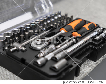 Comprehensive tool set containing various sockets, screwdriver bits, and a powerful ratchet wrench, ideal for home improvement, professional, and mechanical work 135689797