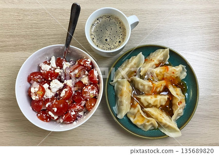 Homemade Dumplings, Fresh Tomato Feta Salad, and Coffee for a Balanced Meal Homemade Dumplings, Fresh Tomato Feta Salad, and Coffee for a Balanced Meal 135689820