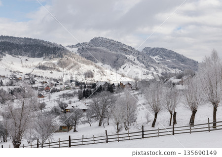 Snowy mountain village in winter, Carpathian Mountains, Romania Snowy mountain village in winter, Carpathian Mountains, Romania 135690149