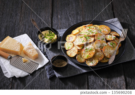 Roasted Potato Slices with Parmesan Cheese Top View 135690208