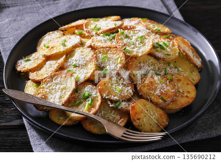Roasted Potato Slices with Parmesan Cheese Top View 135690212