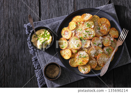 Roasted Potato Slices with Parmesan Cheese Top View 135690214