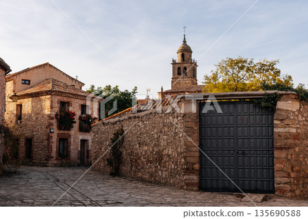 Medinaceli old village street with stone houses and church Medinaceli old village street with stone houses and church 135690588