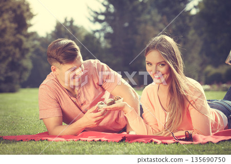 Couple on picnic date outdoor. Couple on picnic date outdoor. 135690750