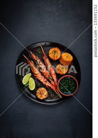langoustines on skewers, shrimp kebab, with fried corn, spices and herbs, homemade, no people, 135691152