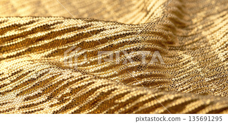 A close-up shot of gold sequin fabric A close-up shot of gold sequin fabric 135691295
