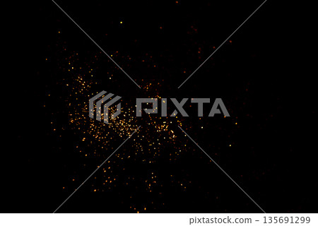 Golden abstract bokeh on black background. 135691299