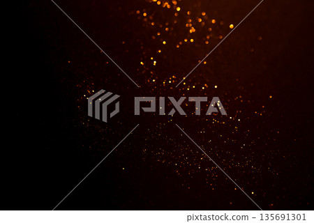 Golden abstract bokeh on black background. 135691301