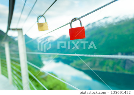 Red padlock and Geirangerfjord from Flydasjuvet viewpoint Norway 135691432