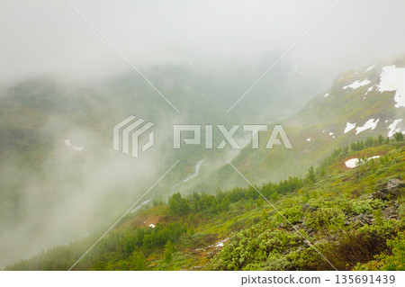 Misty mountains in Norway Misty mountains in Norway 135691439