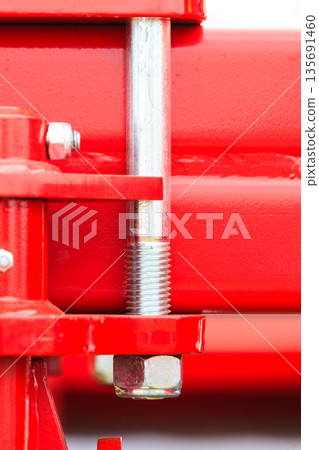 Screws on steel big machinery closeup Screws on steel big machinery closeup 135691460