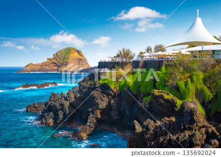 View of the small resort village of Porto Moniz on the Atlantic coast of Madeira Island, Portugal 135692024