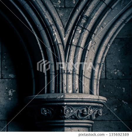 Gothic stone arch detail with medieval architectural ornament and strong structural geometry 135692389