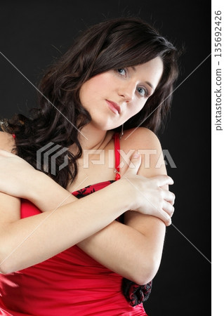 Portrait woman in red corset Portrait woman in red corset 135692426