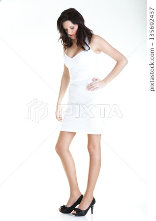 Portrait attractive young woman standing isolated white background Portrait attractive young woman standing isolated white background 135692437