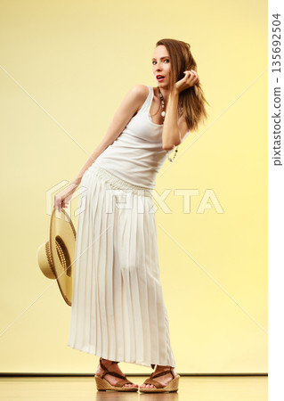 Woman in straw summer hat white dress Woman in straw summer hat white dress 135692504