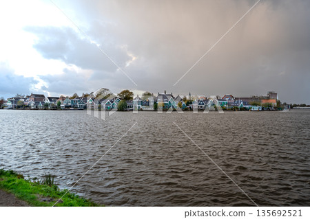 Old houses in Dutch water village of Zaanse Schans building architecture Netherlands. Waterfront landscape Old houses in Dutch water village of Zaanse Schans building architecture Netherlands. Waterfront landscape 135692521