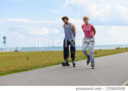 Cheerful couple enjoying ride together. Cheerful couple enjoying ride together. 135693089