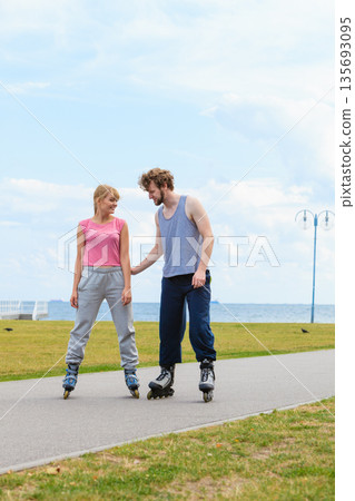 roller skater couple skating outdoor roller skater couple skating outdoor 135693095