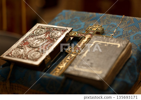 Orthodox Cross and Gospel Book on Church Altar Before Baptism 135693171