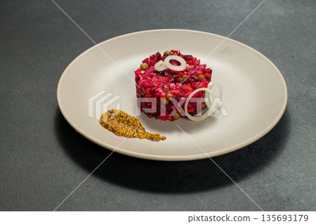 Classic Russian Beet Salad with Mustard Seeds on Plate. Vinaigrette 135693179