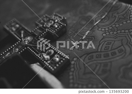 Silver Cross Necklace on Wooden Church Bench with Lace Cloth 135693200