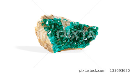Stunning green mineral stone specimen emerald-green dioptase crystal formations, isolated Stunning green mineral stone specimen emerald-green dioptase crystal formations, isolated 135693620