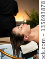 Professional hair care procedure focused on relaxation, hydration, and healthy scalp treatment. 135693878