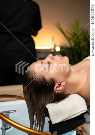 Professional hair care procedure focused on relaxation, hydration, and healthy scalp treatment. 135693878