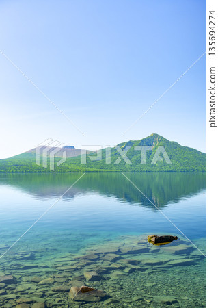 Lake Shikotsu, Mt. Tarumae, and Mt. Fuppushi in early summer, Chitose City Lake Shikotsu, Mt. Tarumae, and Mt. Fuppushi in early summer, Chitose City 135694274