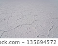 Abstract texture of white hexagonal salt crust in Salar de Uyuni, Bolivia 135694572