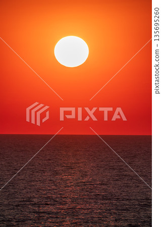 Beautiful red and orange sunrise over the sea. 135695260