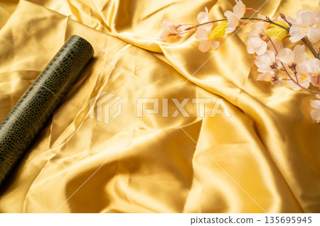Golden background with diploma and cherry blossoms 135695945