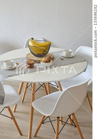 Modern scandinavian dining table with fruit and coffee 135696282