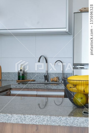 Modern kitchen interior with granite countertop and sink Modern kitchen interior with granite countertop and sink 135696328