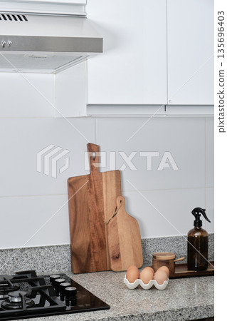 Minimalist kitchen interior design with cooking essentials 135696403